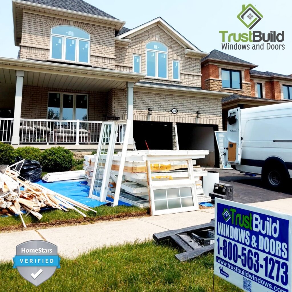 A before-and-after comparison of a basement window. The top shows a worn sliding window, while the bottom features a bright white, modern sliding unit installed in the brick wall.