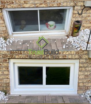 A before-and-after comparison of a basement window replacement. The top image shows an old, two-pane sliding window, while the bottom displays a new, bright white vinyl sliding window.